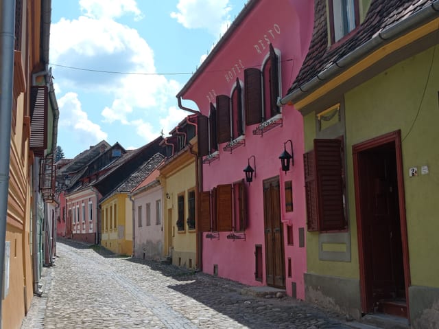 A cobbled lane of painted houses in the centre of Sighișoara