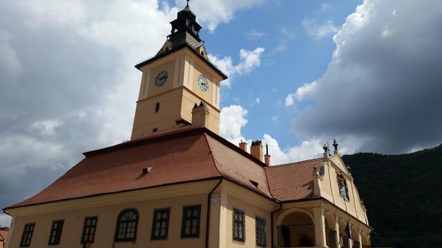 The old council house and its clock tower in Brașov